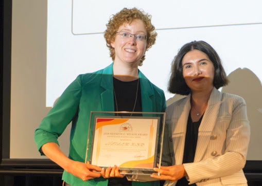 Zohreh Davoudi handing the Wilson Award to Natalie Klco