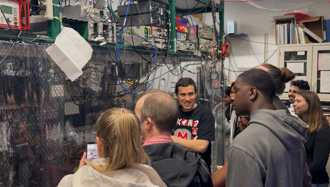 Norbert Linke, explaining an ion-trap quantum computer to visitors at Maryland Day.