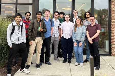 2025 summer interns in front of QLab building.