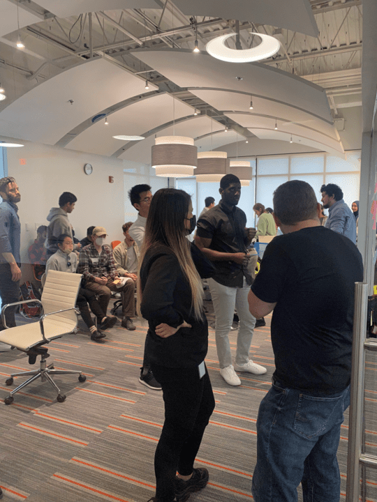 group standing in a modern style conference room